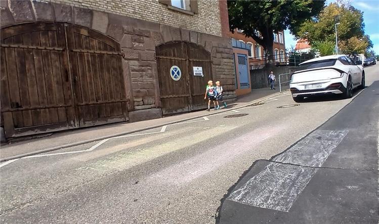 Unknown persons paint zebra crossings on the road
