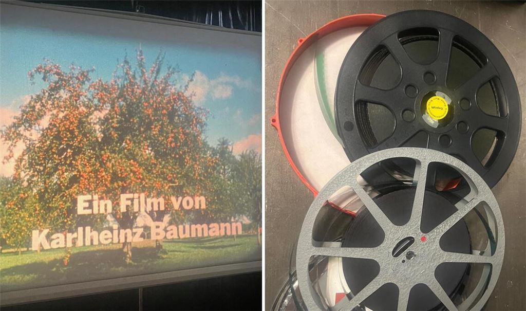 Der 16mm-Film ist aufgerollt und wird auf eine Leinwand im Park der Villa Berg projiziert.