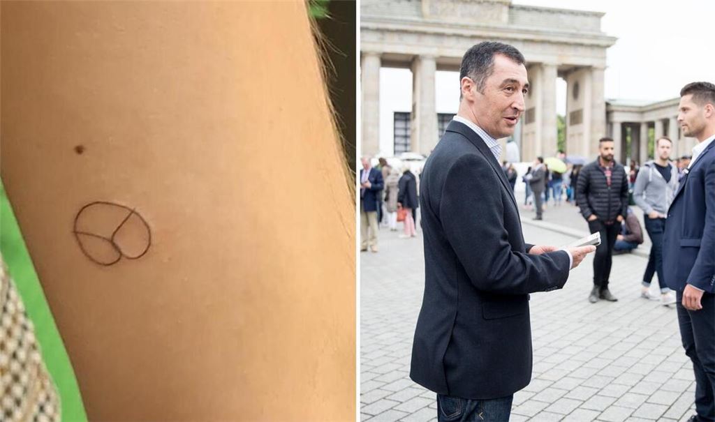 Die Grünen haben auf ihrer Wahlparty kostenlose Tattoos angeboten. Der Grünen-Politiker Cem Özdemir bekommt seit Jahren Polizeischutz. Das Bild zeigt ihn 2016 vor dem Brandenburger Tor.