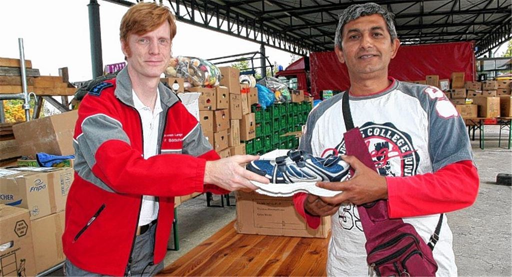 Im Bruchsaler Camp kümmern sich Helfer um Flüchtlinge aus verschiedenen Ländern, Foto: DRK