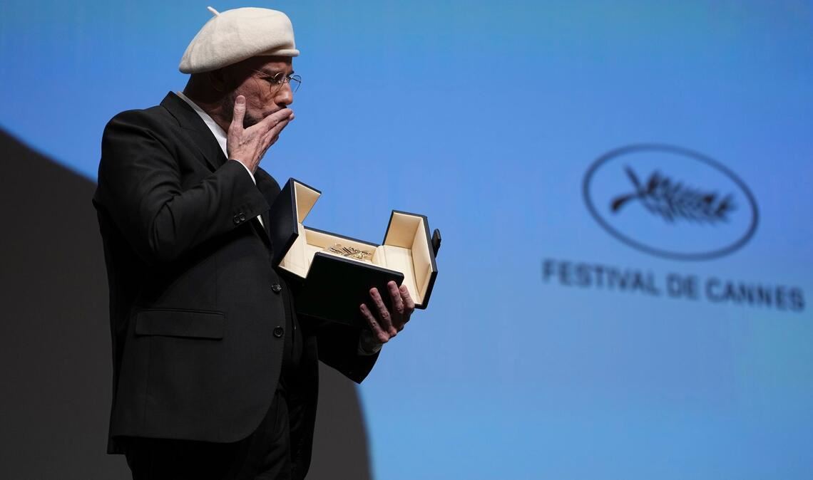 John Travolta wurde mit der Goldenen Ehren-Palme überrascht.
